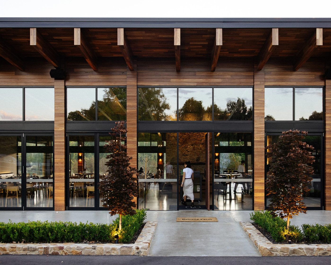 Beltana Farm restaurant entrance with glazed bi-fold doors at dusk