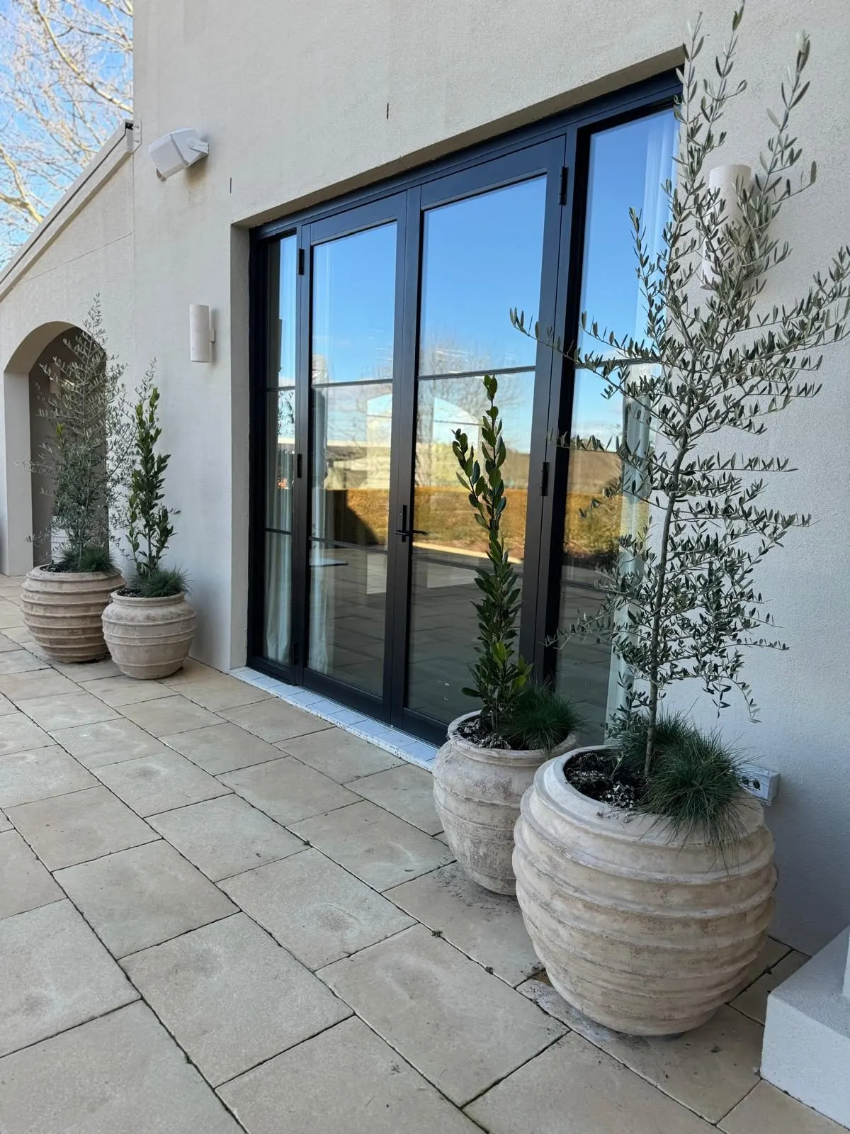 Shaw Estate patio with black-framed glass bi-fold doors